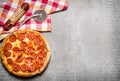 Pepperoni pizza with salami and cheese. On stone table. Royalty Free Stock Photo