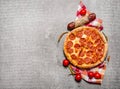 Pepperoni pizza with salami and tomatoes. On stone table. Royalty Free Stock Photo