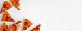 Pepperoni pizza slice corner border over a white marble banner background Royalty Free Stock Photo