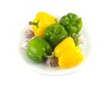 Peppers and garlic on white plate isolated close up Royalty Free Stock Photo