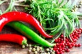 Peppers and herbs on table