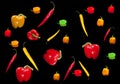 Peppers mix on black background. Hot chili, cayenne and Habanero peppers. Yellow and red paprika. Spicy oriental cuisine.