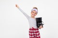 Peppy girl in pajamas just woke up and yawns while holding a coffee machine on a white background with copy space Royalty Free Stock Photo