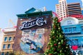 Pepsi Cola colorful vintage advertisement one the exterior of New York-New York Hotel and Casino. Decorated Christmas tree - Las