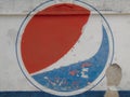 Pepsi logo on run-down wall