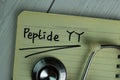 Peptide YY write on a book isolated on office desk