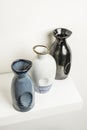 Small decorative porcelain bottles of different colors on