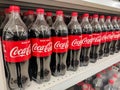 Selective focus. Bottle of Coca cola drinking water sold in a supermarket.Shot were noise and artifacts.