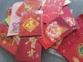 A pile of red packet containing gift of money packed inside given as token of good wishes during auspicious occasions