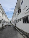 Worker climbed high up to the second storey building servicing the outlet air condition unit