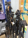 Various type of big and small photography tripods on displayed and sale at N4 Camera stor Royalty Free Stock Photo