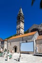 Perast in hte Bay of Kotor with views on the rising mountains and the church of the lady of the Rocks