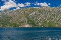 Perast in hte Bay of Kotor with views on the rising mountains and the church of the lady of the Rocks