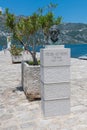 Perast, Montenegro - June 10. 2019: monument to famous Croatian travel writer, translator and poet Frano Alfirevic, sculptor Ivan