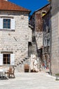 Perast in hte Bay of Kotor with views on the rising mountains and the church of the lady of the Rocks