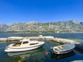 Perast town view, boats, mountains and clear water, Montenegro