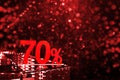 70 percent discount with red bokeh background. Discounts in the shopping center. Seasonal sale, black friday. Red label