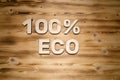 100 percent ECO words made of wooden block letters on wooden board Royalty Free Stock Photo