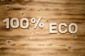 100 percent ECO words made of wooden block letters on wooden board Royalty Free Stock Photo