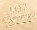 100 percent Erholung drawn in beach sand