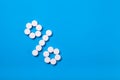 A percent sign of drugs on a blue background top view. Royalty Free Stock Photo