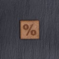 Percent Sign In Square Wooden Tiles - Symbol On Black Stone Background Royalty Free Stock Photo
