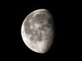 76 percent waning lunar moon in black night sky Royalty Free Stock Photo