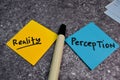 Perception or Reality write on a sticky note isolated on the table Royalty Free Stock Photo