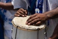 Percussionist's hands resting on top of the atabaque