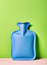 Perennial favorite hot water bottle isolate in green background.