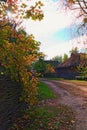 Winding narrow dirt village road. Picturesque landscape of ancient Ukrainian village Royalty Free Stock Photo