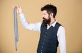 The perfect accessory for any man. Businessman looking at formal necktie accessory. Brutal caucasian man holding fashion