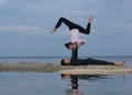 Perfect acroyoga. Beautiful young couple is doing yoga Royalty Free Stock Photo