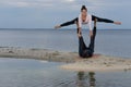 Perfect acroyoga. Beautiful young couple is doing yoga Royalty Free Stock Photo