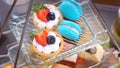 Assortment of rich, colorful tartlets and macarons