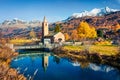 Perfect autumn view of San Lurench church in Sils im Engadin village. Stunning morning scene of Swiss Alps. Sunny landscape of Sil Royalty Free Stock Photo