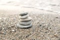 Perfect balance of stack of pebbles on the seashore. Concept of balance, harmony and meditation. Helping or supporting someone for