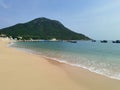 A perfect beach day with the palms and gentle sea waves Royalty Free Stock Photo