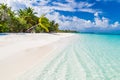 Maldives paradise beach. Perfect tropical island. Beautiful palm trees and tropical beach. Moody blue sky and blue lagoon Royalty Free Stock Photo
