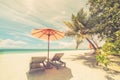 Beautiful beach. Chairs on the sandy beach near the sea. Summer holiday and vacation concept. Inspirational tropical scene. Royalty Free Stock Photo