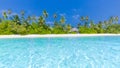 Maldives paradise beach. Perfect tropical island. Beautiful palm trees and tropical beach. Moody blue sky and blue lagoon Royalty Free Stock Photo