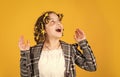 Perfect beauty. Girl with curlers and hair clips in her hair on yellow background. Little girl curlers around her hair