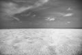 Abstract dramatic beach scene, black and white monochrome sand sea sky concept