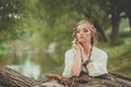 Perfect blonde model woman in boho style dress at the lake outdoor Royalty Free Stock Photo