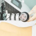 Perfect body radio treatment. Woman at spa procedure. Doctor hand and girl body Royalty Free Stock Photo