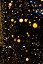 Perfect bokeh for a festive New Year and Christmas background. Defocused circles of yellow and blue light