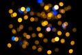 Perfect bokeh for a festive New Year and Christmas background. Defocused abstract yellow and blue light circles