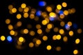 Perfect bokeh for a festive New Year and Christmas background. Defocused abstract yellow and blue light circles.