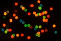 Perfect bokeh for a festive New Year and Christmas background. Defocused abstract yellow, green light circles.