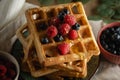 Golden baked waffels with fresh berries